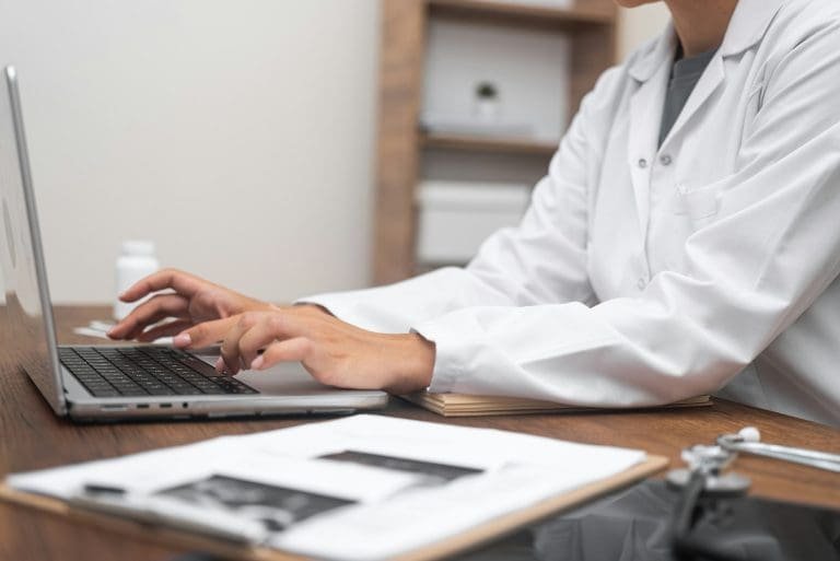provider using laptop, video consultations, illustrating the heart of cash based practice telehealth